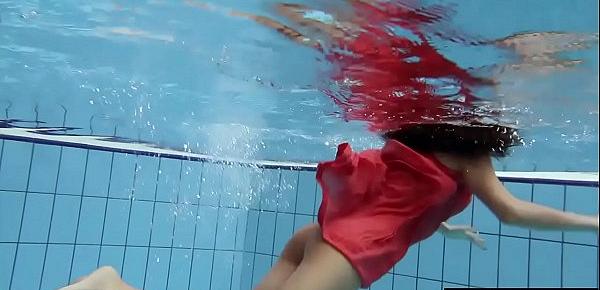  Sexy brunette Anna in red dress swimming